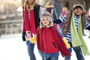 family ice skating outdoors